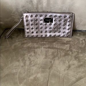 Gently used Coach Silver Rivet Wristlet.